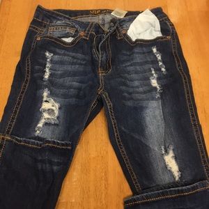 Distressed dark wash jeans. Never worn.